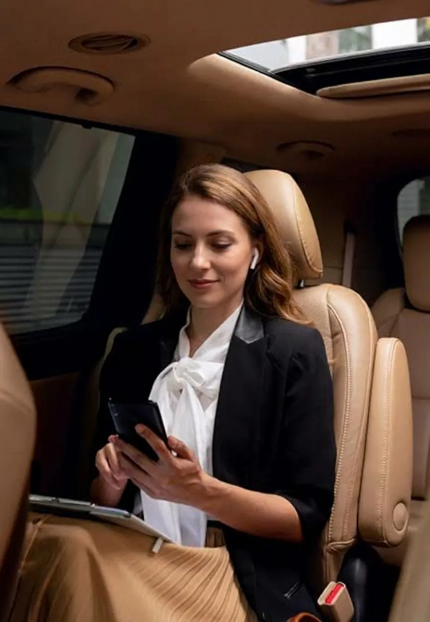 Traveller relaxing in the back of a private van