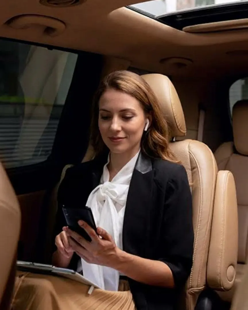 Traveller relaxing in the back of a private van