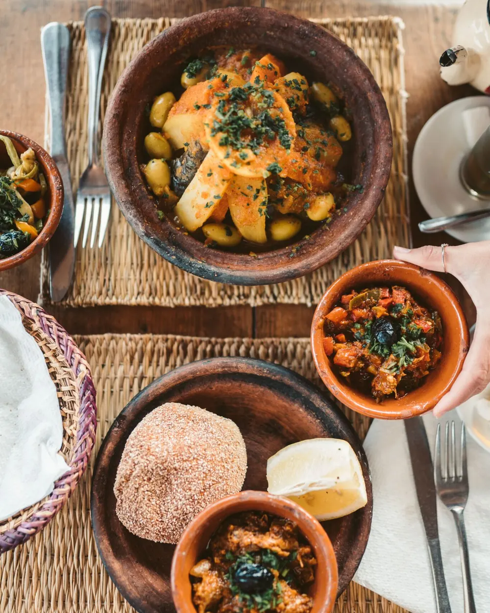 Tagines and bread on a table
